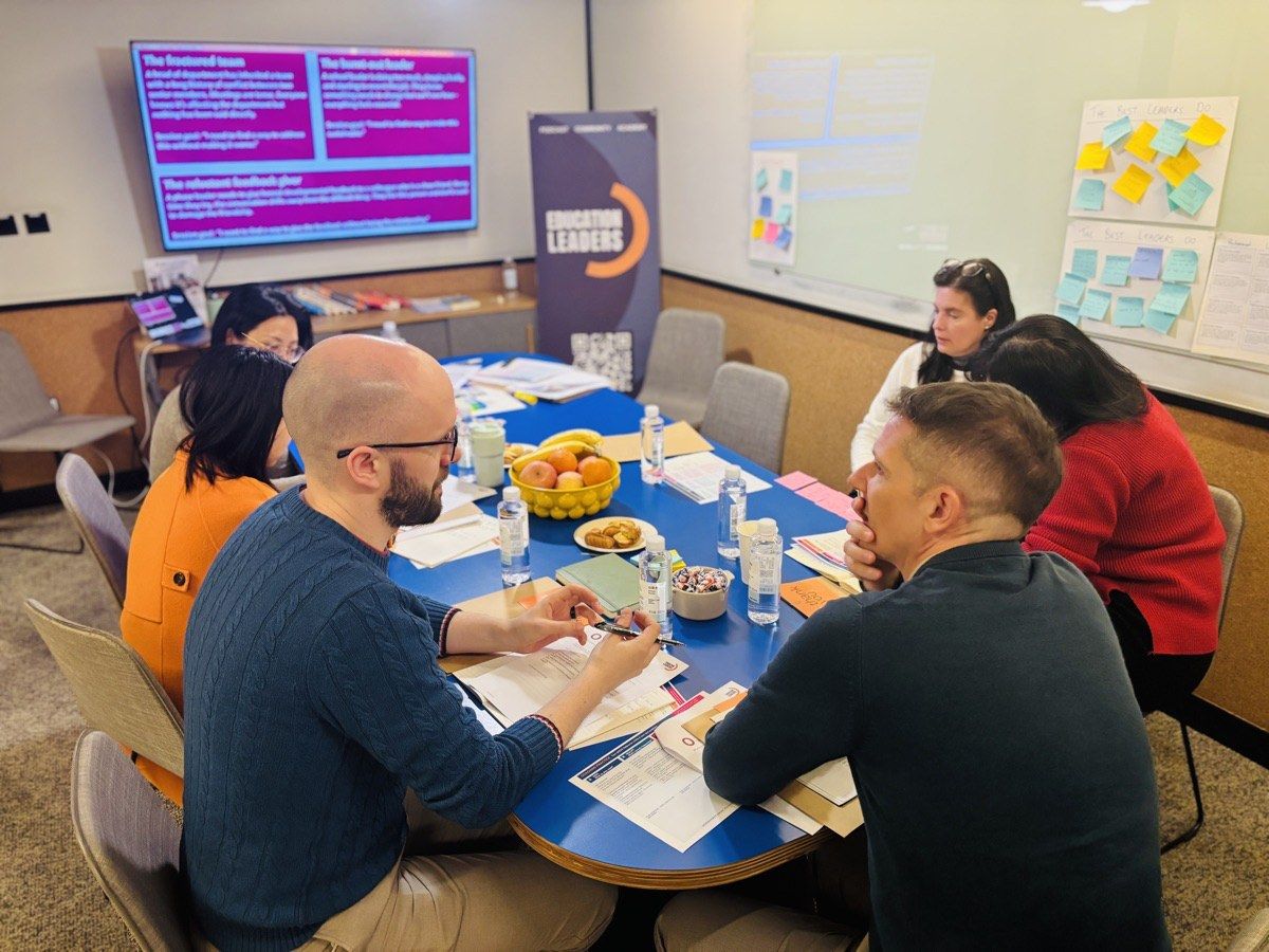 School leaders working together at a table during an Education Leaders workshop